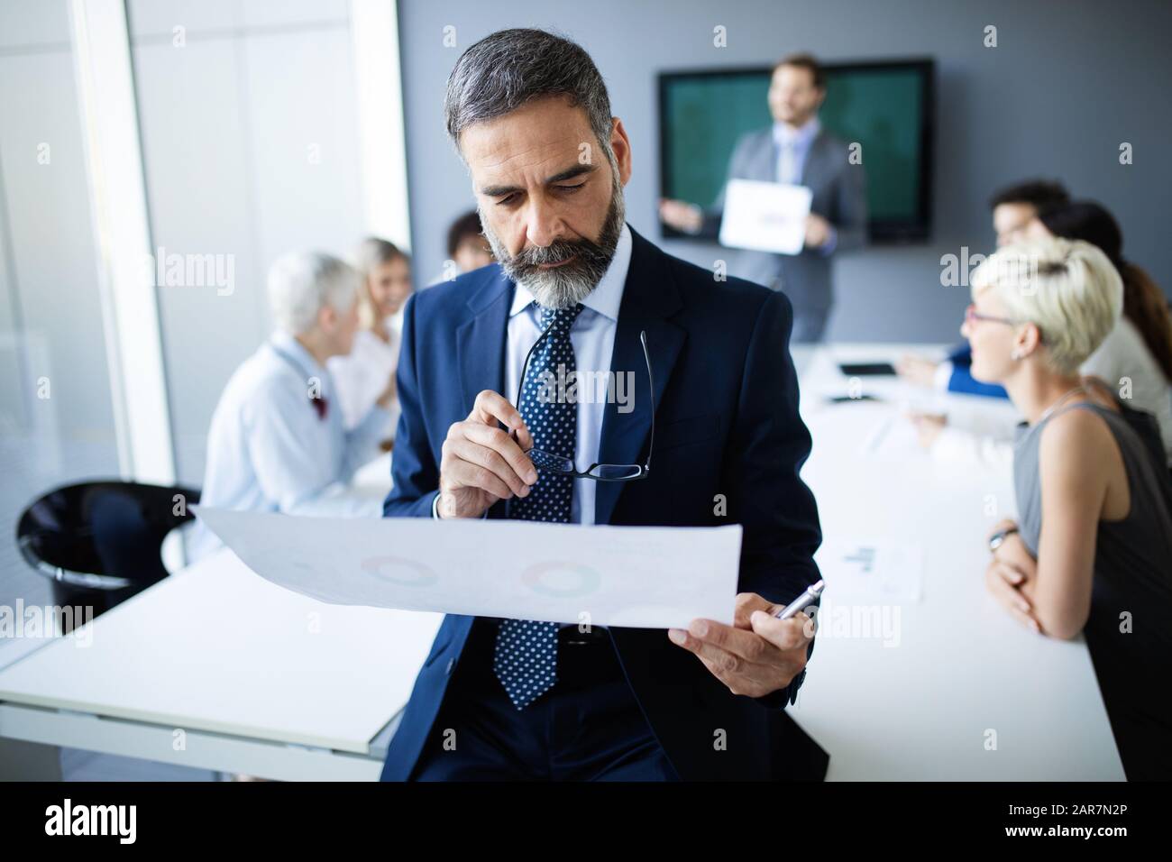 Shot of thinking financial advisor businessman working in office Stock ...