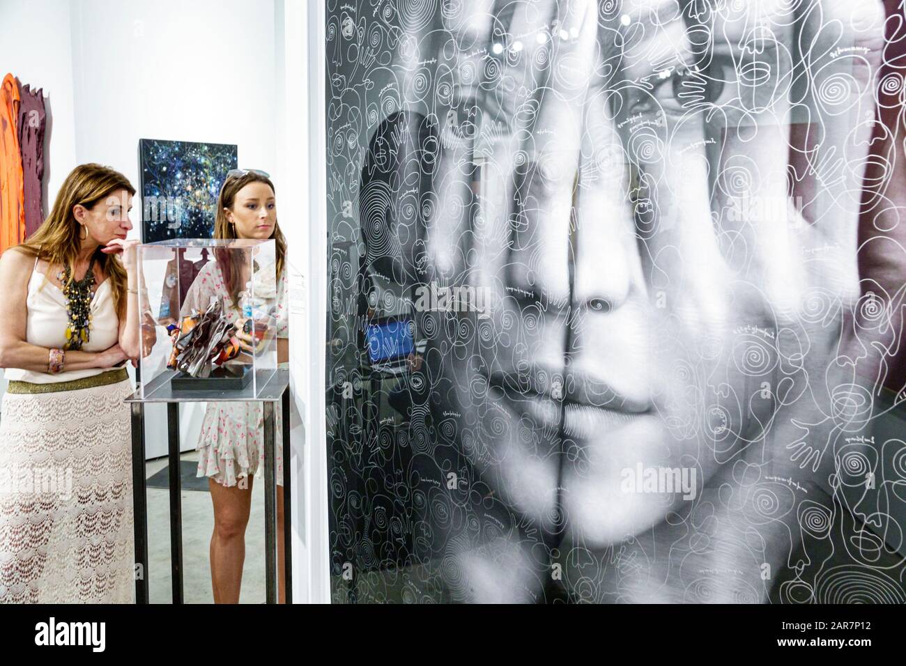 Miami Florida,Art Basel,Art Miami,inside interior,interior inside,gallery galleries exhibit exhibition collection,woman women female lady adult adults Stock Photo