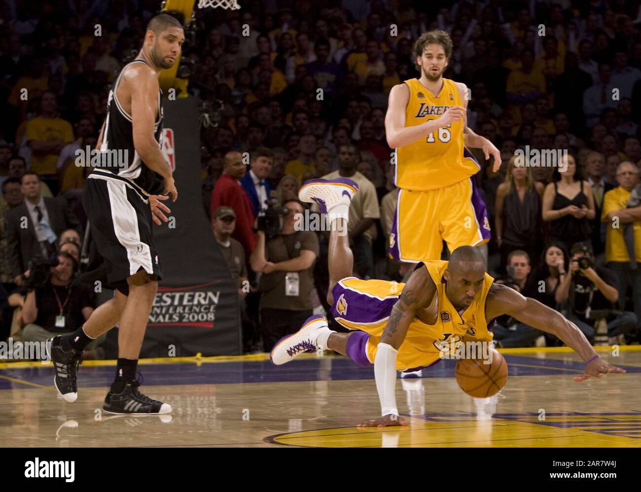 Former Laker Kobe Bryant waves to the crowd during his jersey