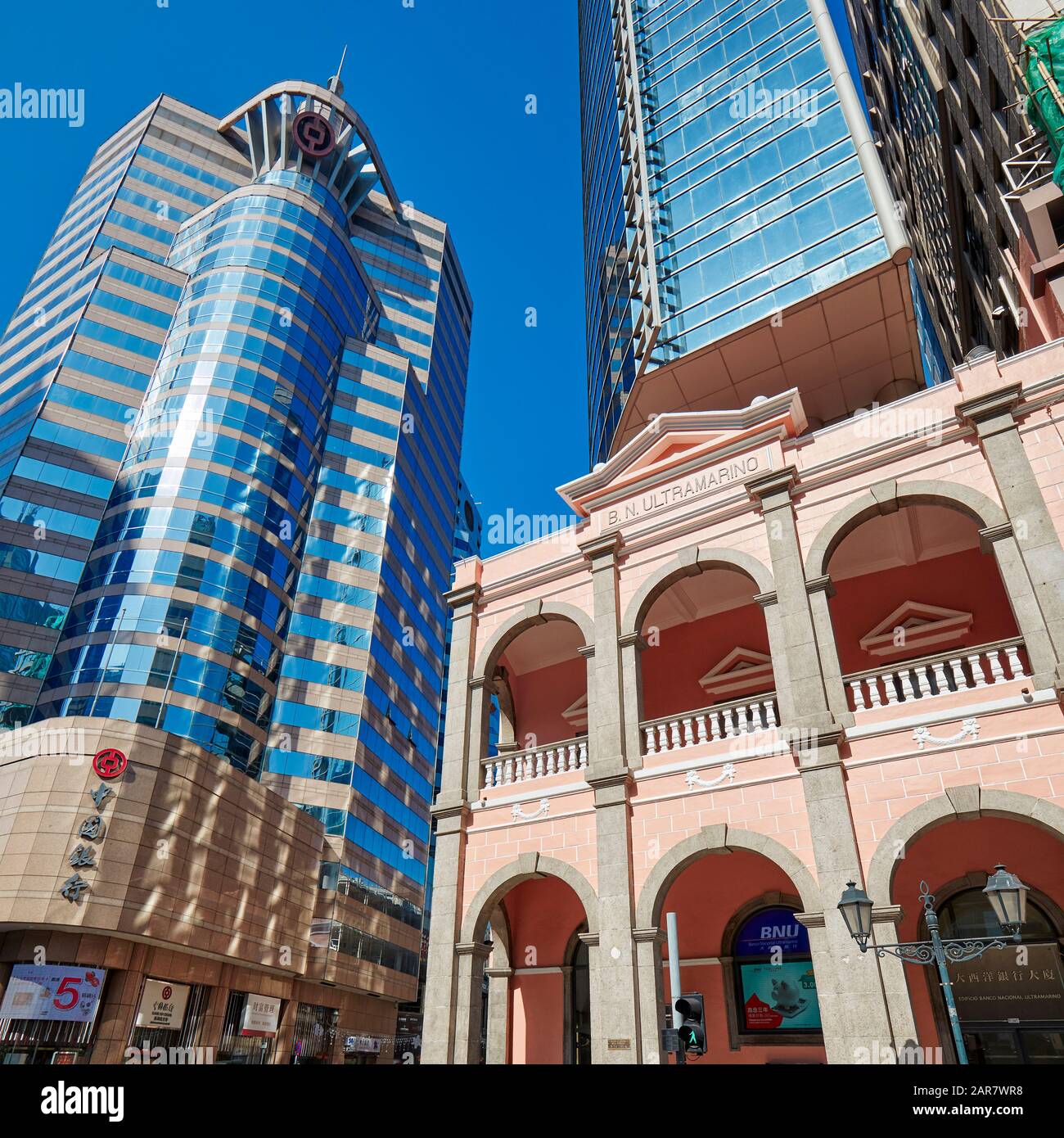 Building of the Banco Nacional Ultramarino (BNU) and nearby high-rise buildings. Macau, China. Stock Photo