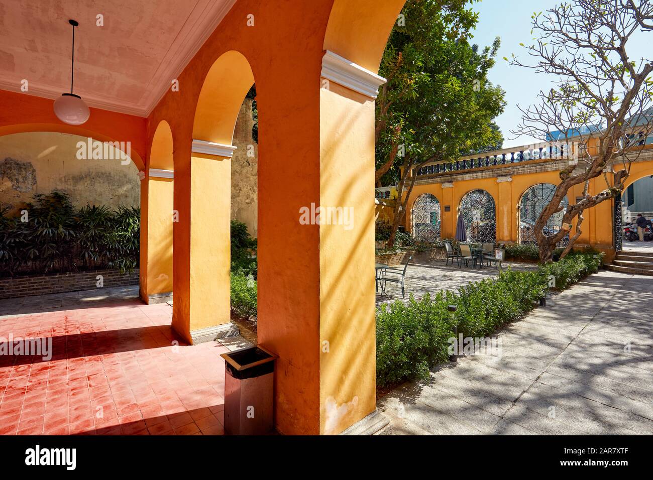 Porch and courtyard of historic colonial mansion now housing Sir Robert Ho Tung Library. Macau, China. Stock Photo
