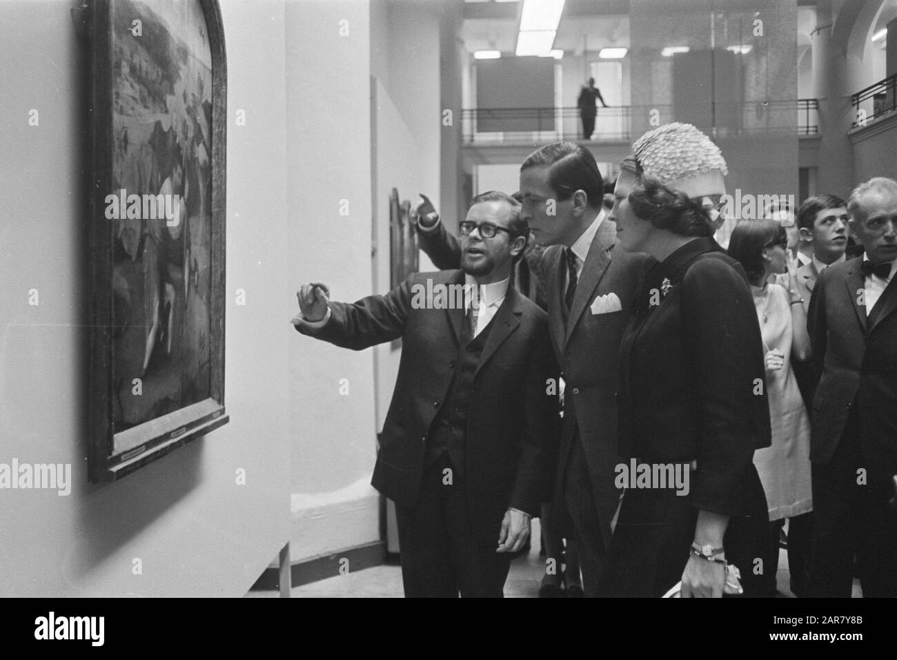 Princess Beatrix and prince Claus at painting exhibition by Jeroen Bosch in Den Bosch. The couple accompanying painting Christopher with artist, art critic and lawyer Ton Frenken (left in the photo), the main organiser of the exhibition. Date: 16 September 1967 Location: 's-Hertogenbosch, Noord-Brabant Keywords: art, princes, princesses, paintings, painting, exhibitions Personal name: Beatrix (princess Netherlands), Bosch, Jeroen, Claus (prince Netherlands), French, Ton Stock Photo