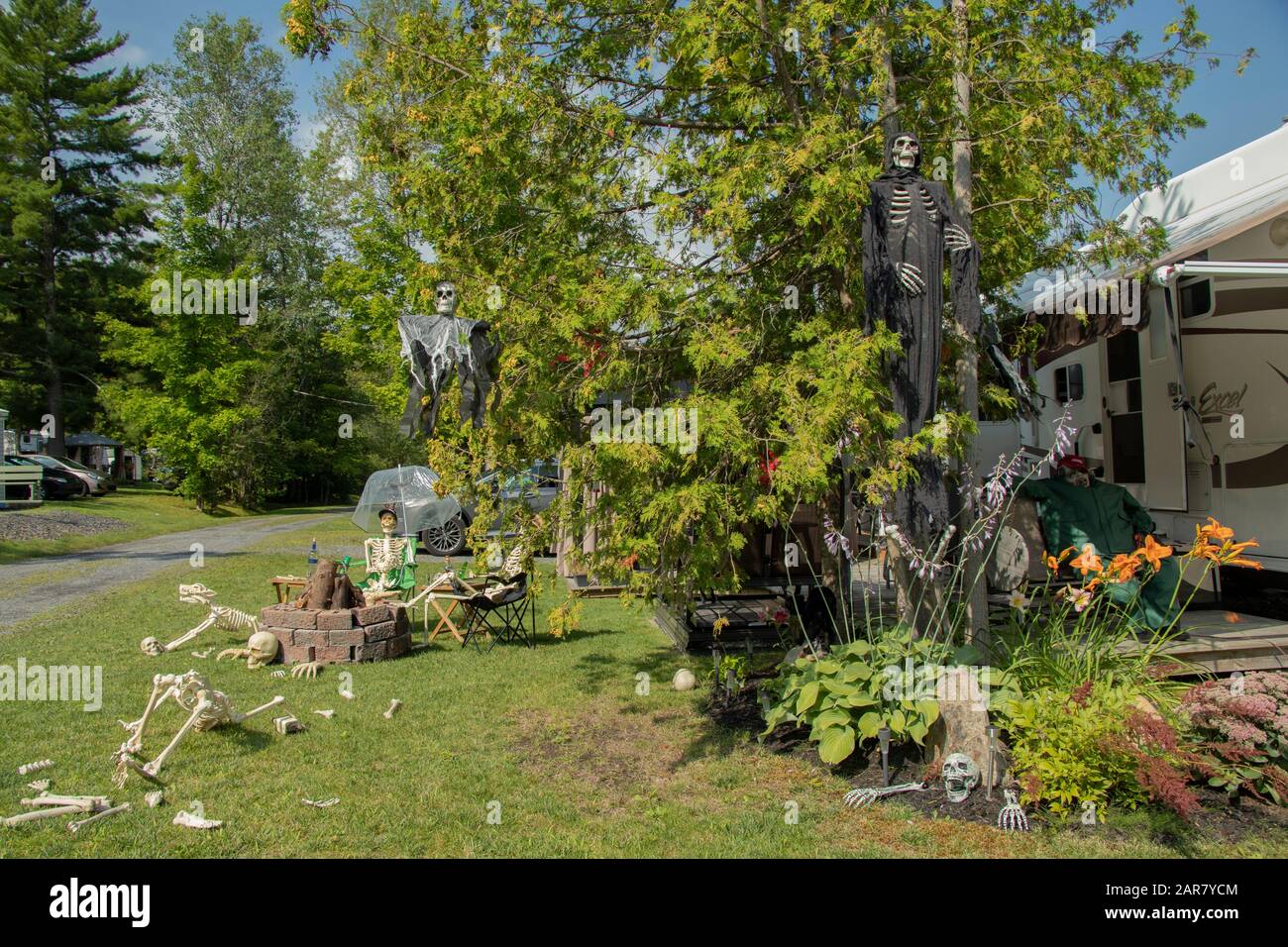 August 17, 2019 - West Brome, Quebec, Canada: Halloween outdoor decor beside a travel trailer on a campsite, Camping Vallée Bleue campground Stock Photo