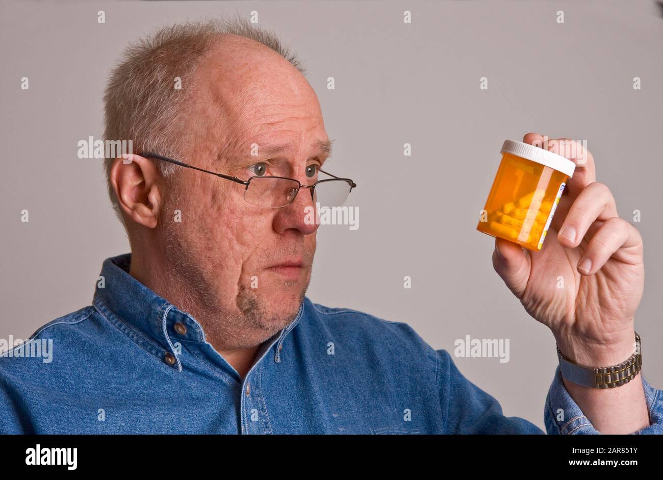 Older man wearing glasses look hi-res stock photography and images - Alamy