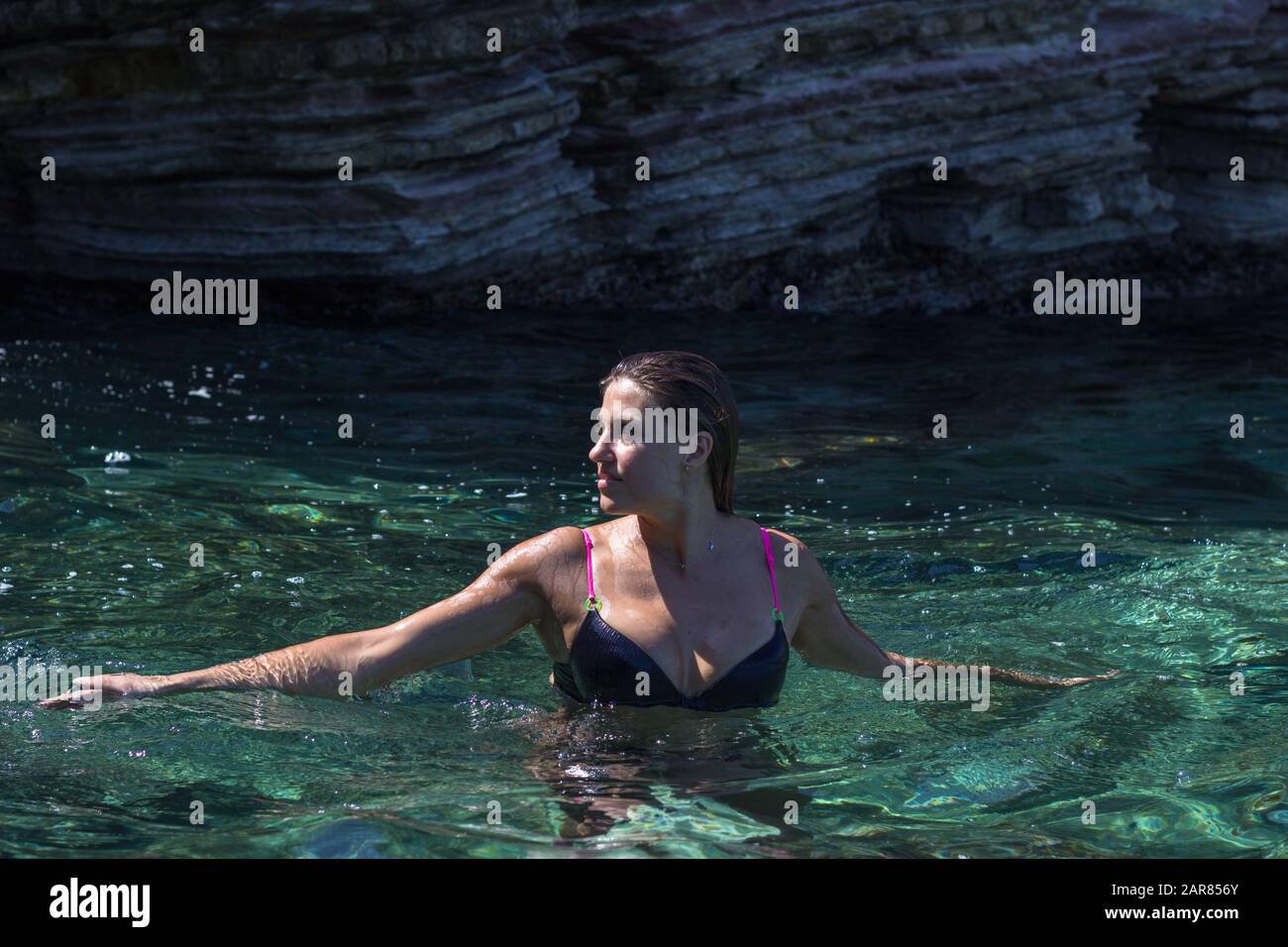 Young woman relaxing swimming Stock Photo