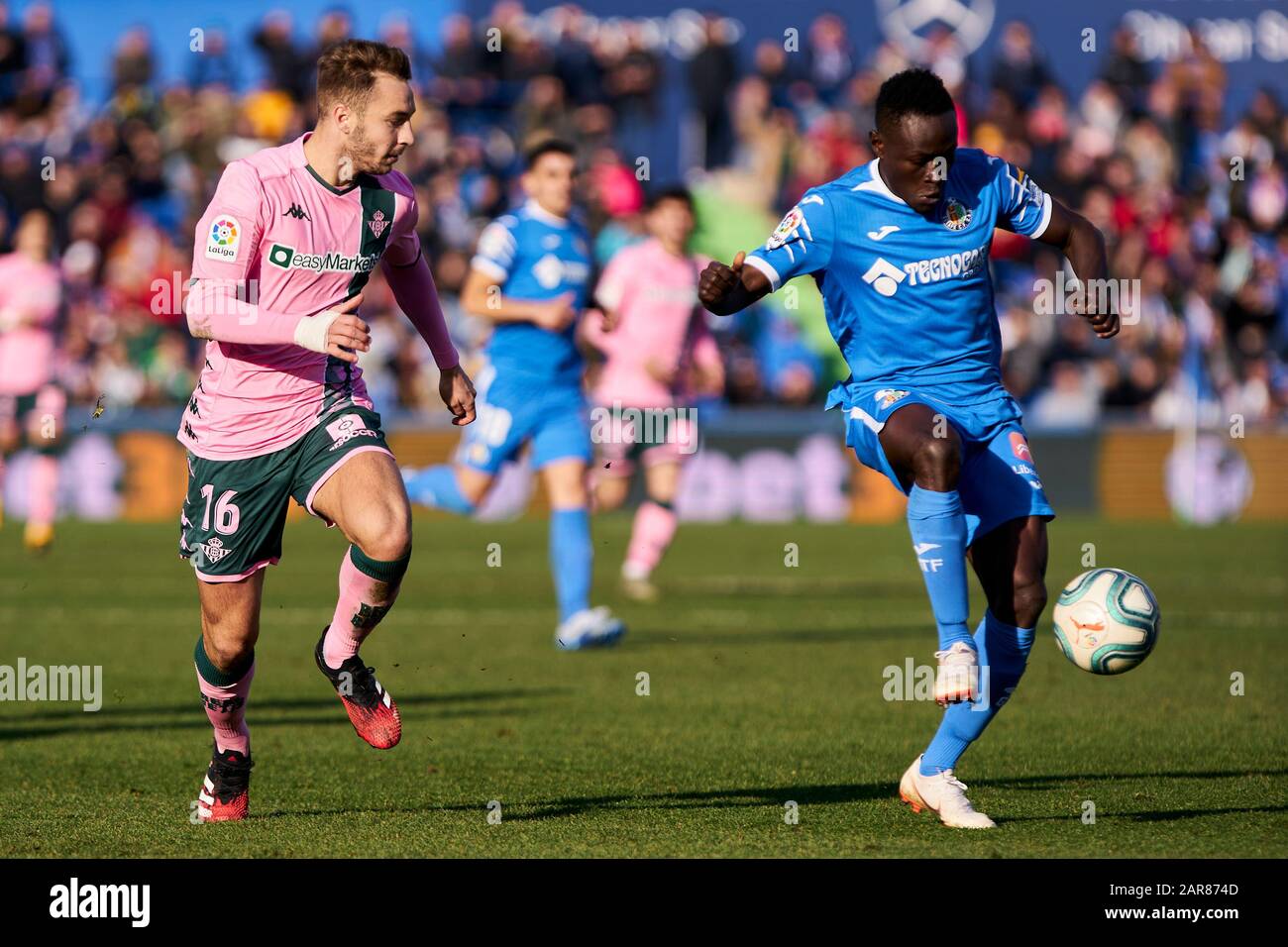 Djene Dakoman of Getafe FC and Loren Moron of Real Betis Balompie are seen in action during the La Liga match between Getafe CF and Real Betis Balompie at Coliseum Alfonso Perez in Getafe. (Final score; Getafe CF 1:0 Real Betis Balompie) Stock Photo