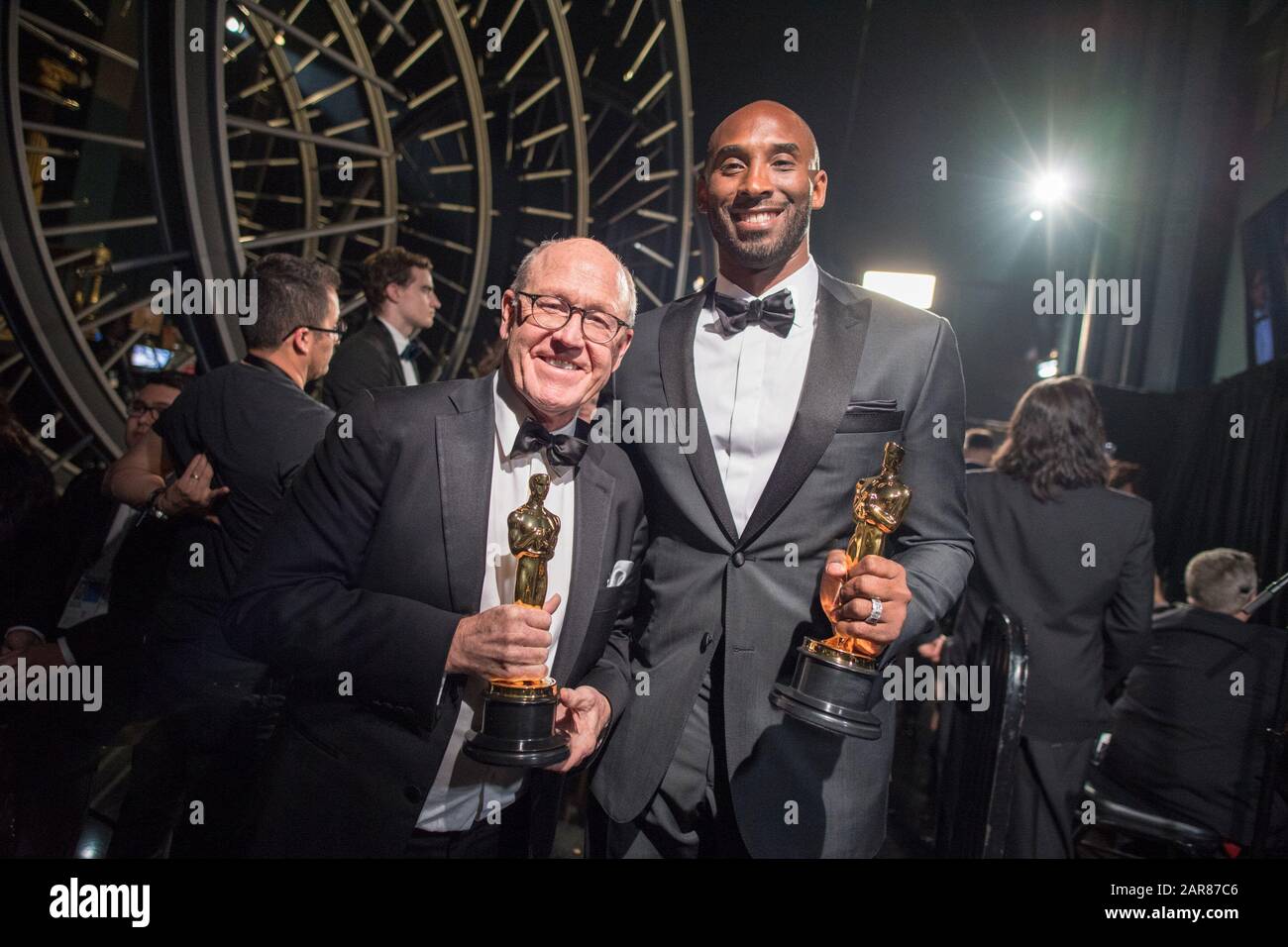 Glen Keane and Kobe Bryant pose backstage with the Oscar® for best