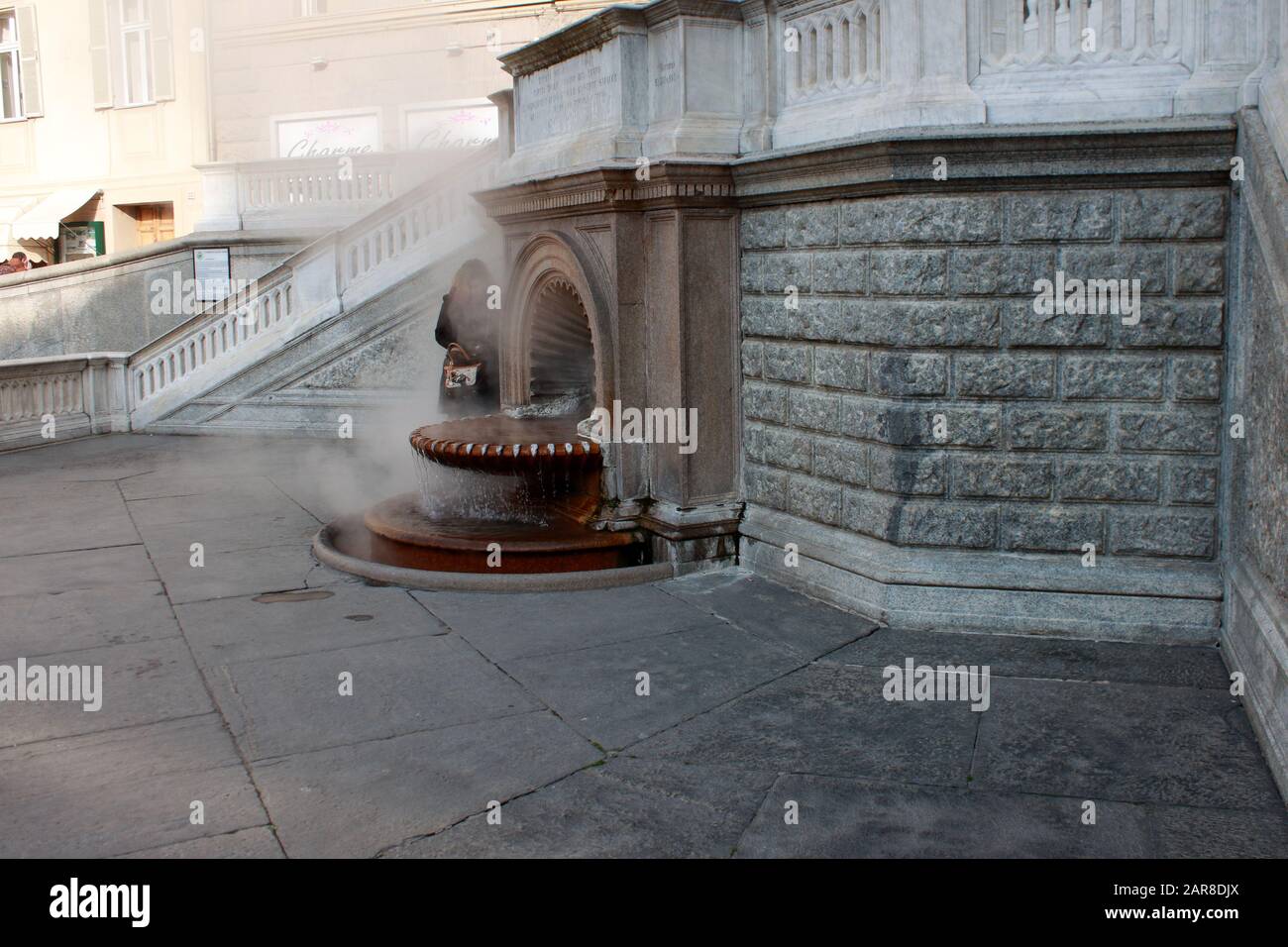 Acqui Terme, famous Italian spa town from Roman times. Central square with a fountain with natural boiling iodine rich water! Stock Photo