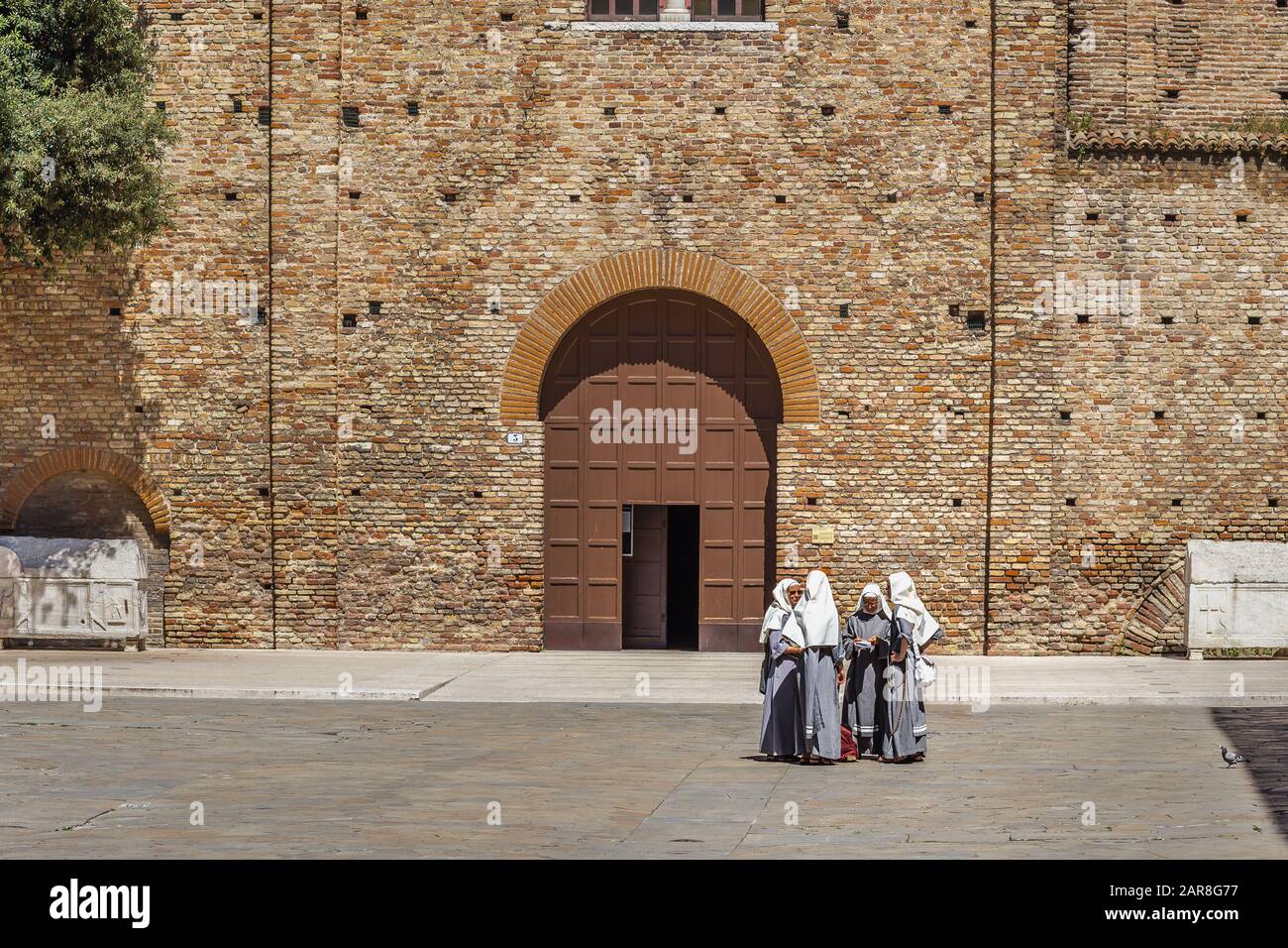 RAVENNA, ITALY - JUNE 19,2019: nuns talking near the Basilica of San Francesco where the funeral of Dante Alighieri was held Stock Photo