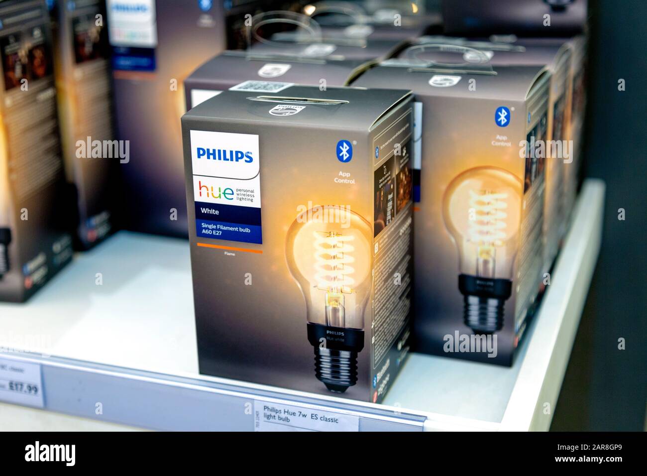 Philips Hue smart lightbulbs on a shelf in a store Stock Photo