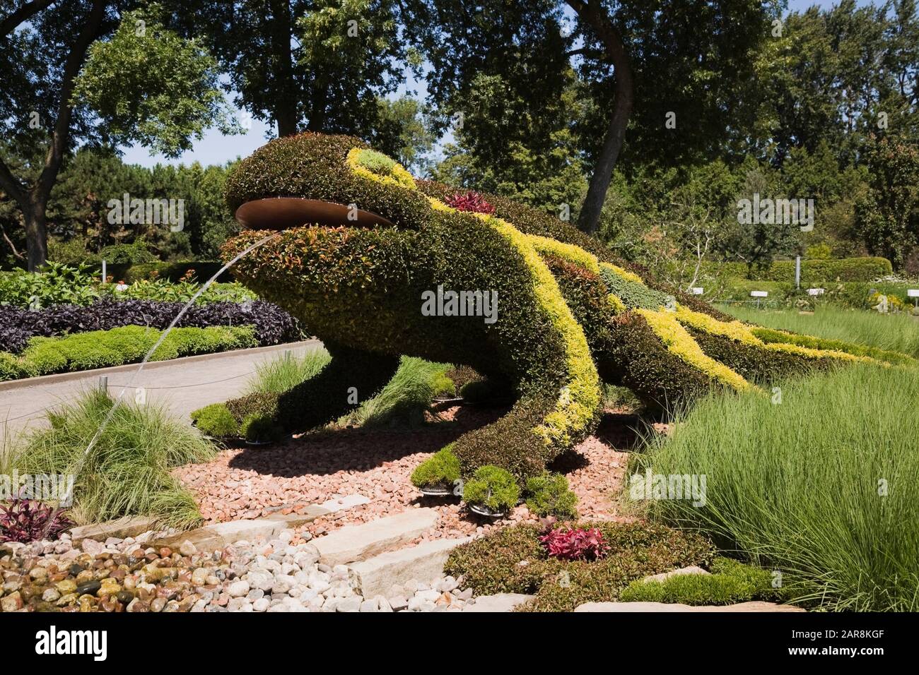 Living plant sculpture in summer called 'The Salamander According to Gaudi' created on metal mesh forms filled with earth and various plants Stock Photo