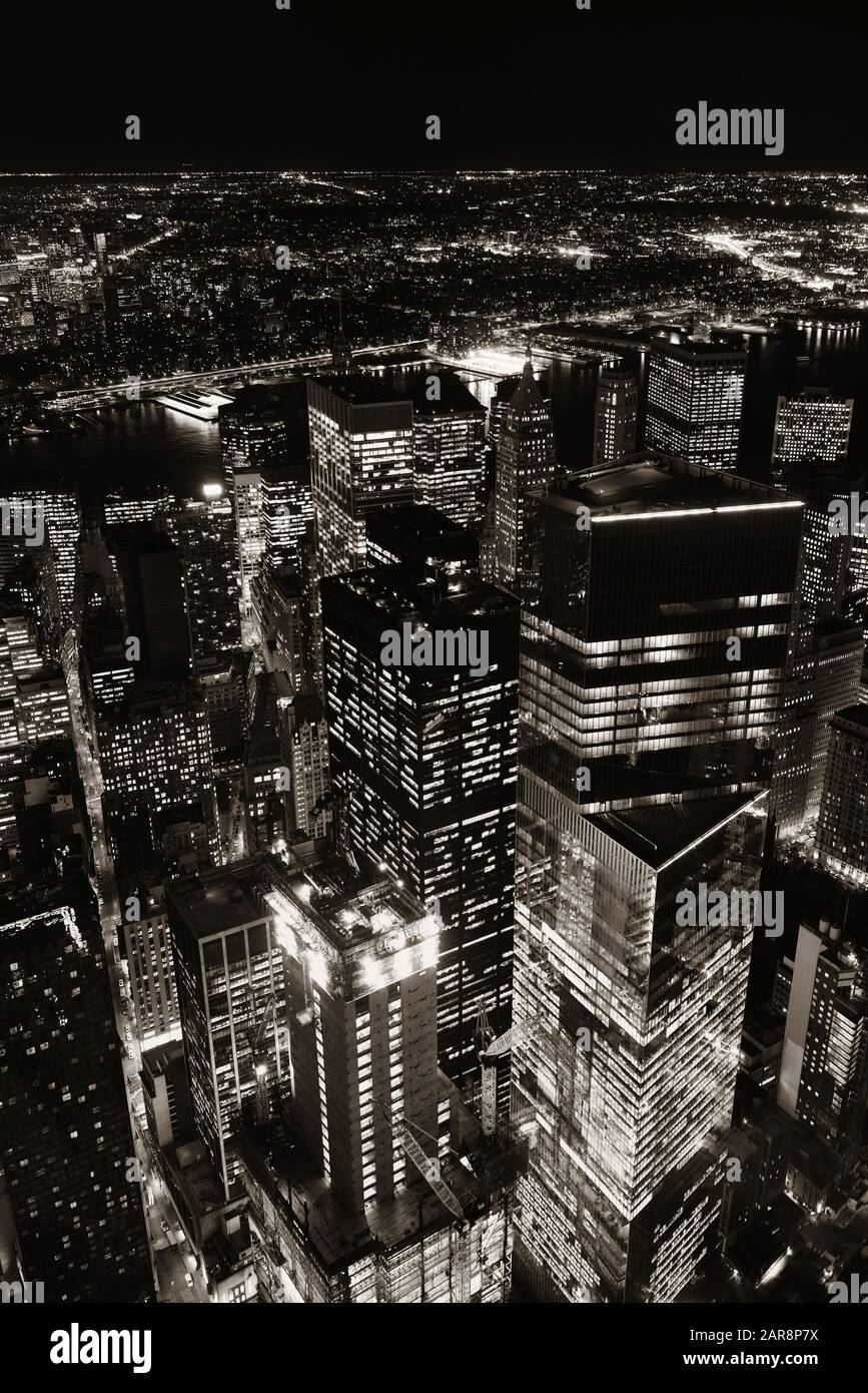 Rooftop night view of New York City downtown with urban skyscrapers ...