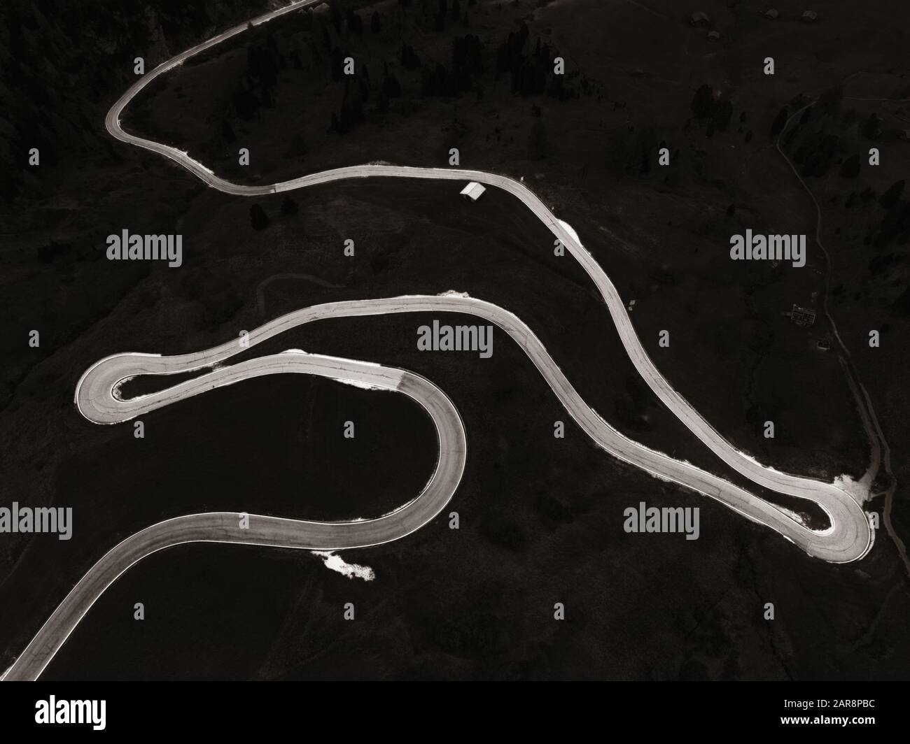 Dolomites winding road aerial view in North Italy Stock Photo - Alamy