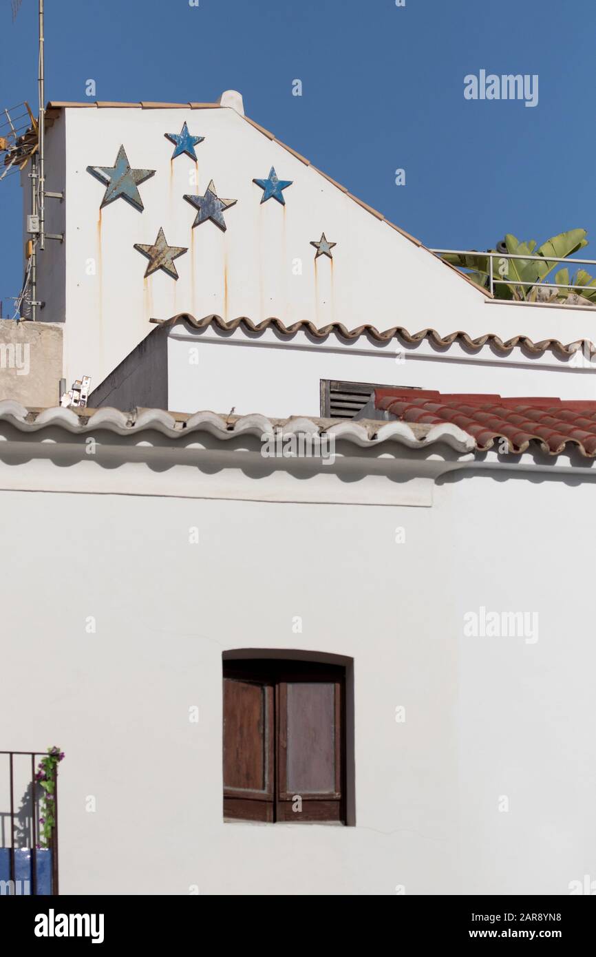 Stars on a building across the rooftops of Eivissa (Ibiza Town), Ibiza, Balearic Islands Stock Photo