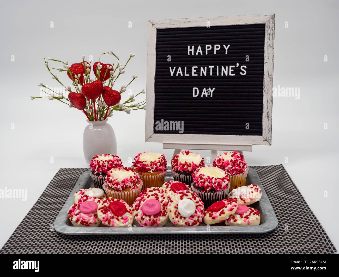 Happy Valentine’s Day Letter Board with Heart Flower Arrangement and a Rustic Tray Full of