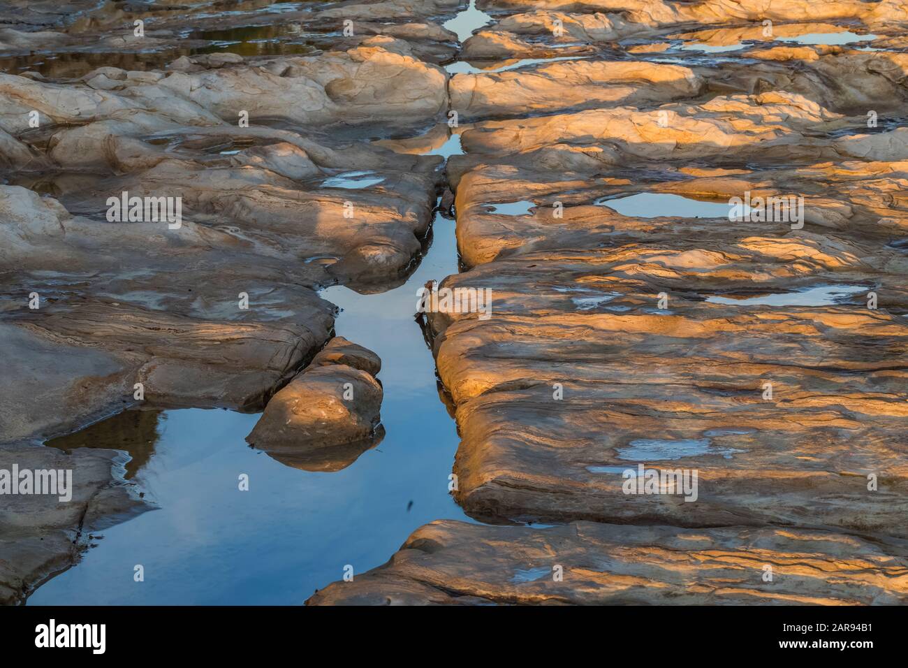 Patterns and lines in mudstone at low tide at Natural Bridges