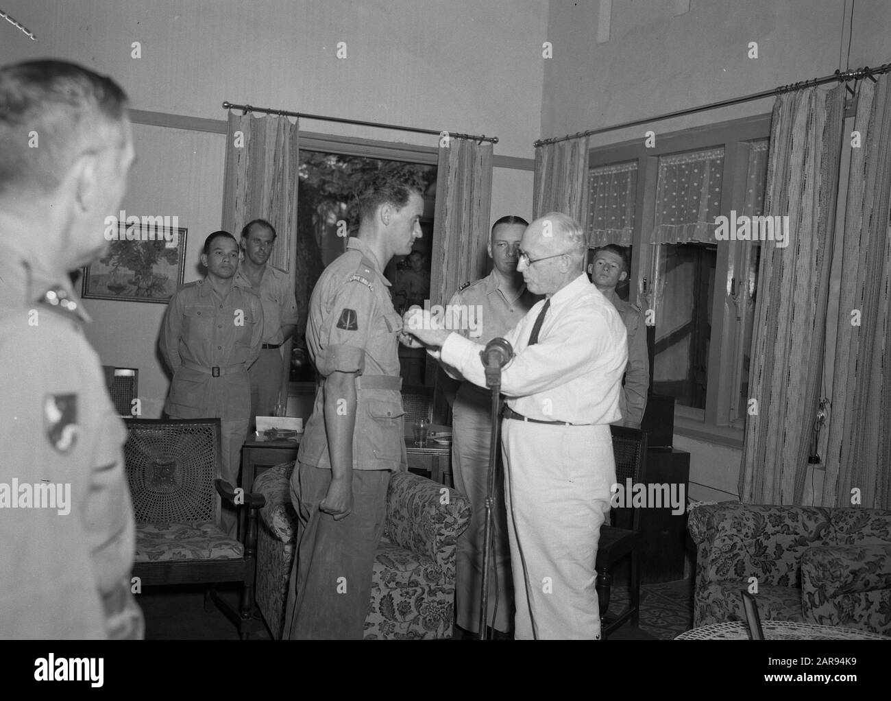 Medal of Freedom Award to Major Bensen  Award of the Medal of Freedom to Major Guillaume Bensen (left) by American consul-general Walter C. Foote ( right) Date: June 20, 1947 Location: Indonesia, Dutch East Indies Stock Photo