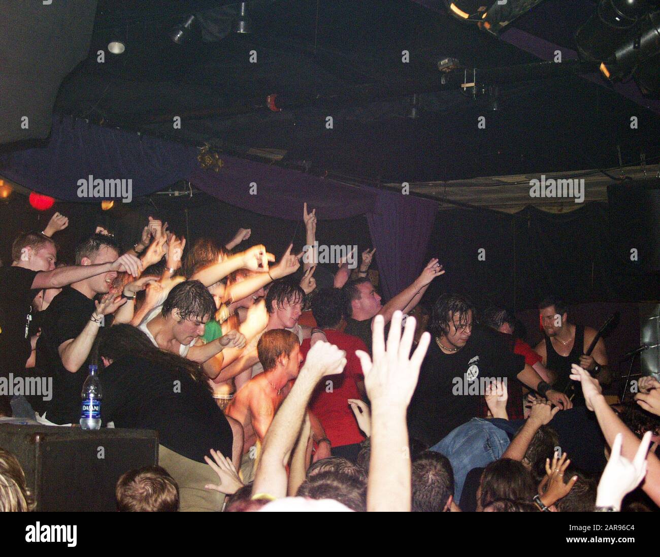 SEPTEMBER 11: The audience storms and takes over the stage during Andrew WK's performance at the 40 Watt Club in Athens, Georgia on September 11, 2002. CREDIT: Chris McKay / MediaPunch Stock Photo