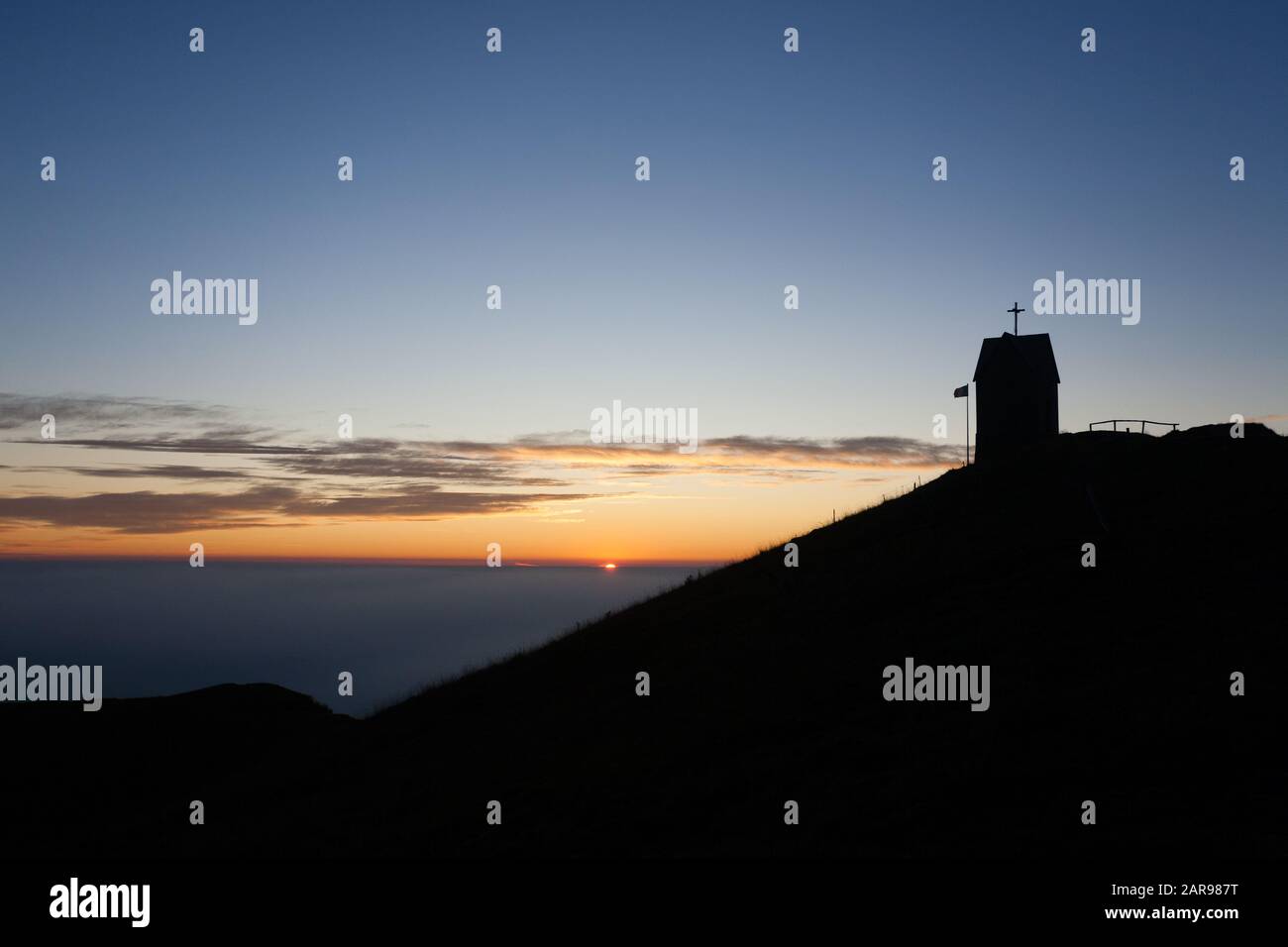 Dawn at the little church, mount Grappa landscape, Italy. Italian alps panorama Stock Photo