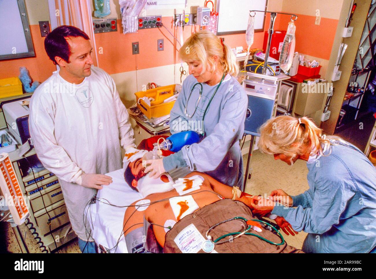 An emergency room trauma team treats an African American patient at a hospital in Mission Viejo, CA. Stock Photo