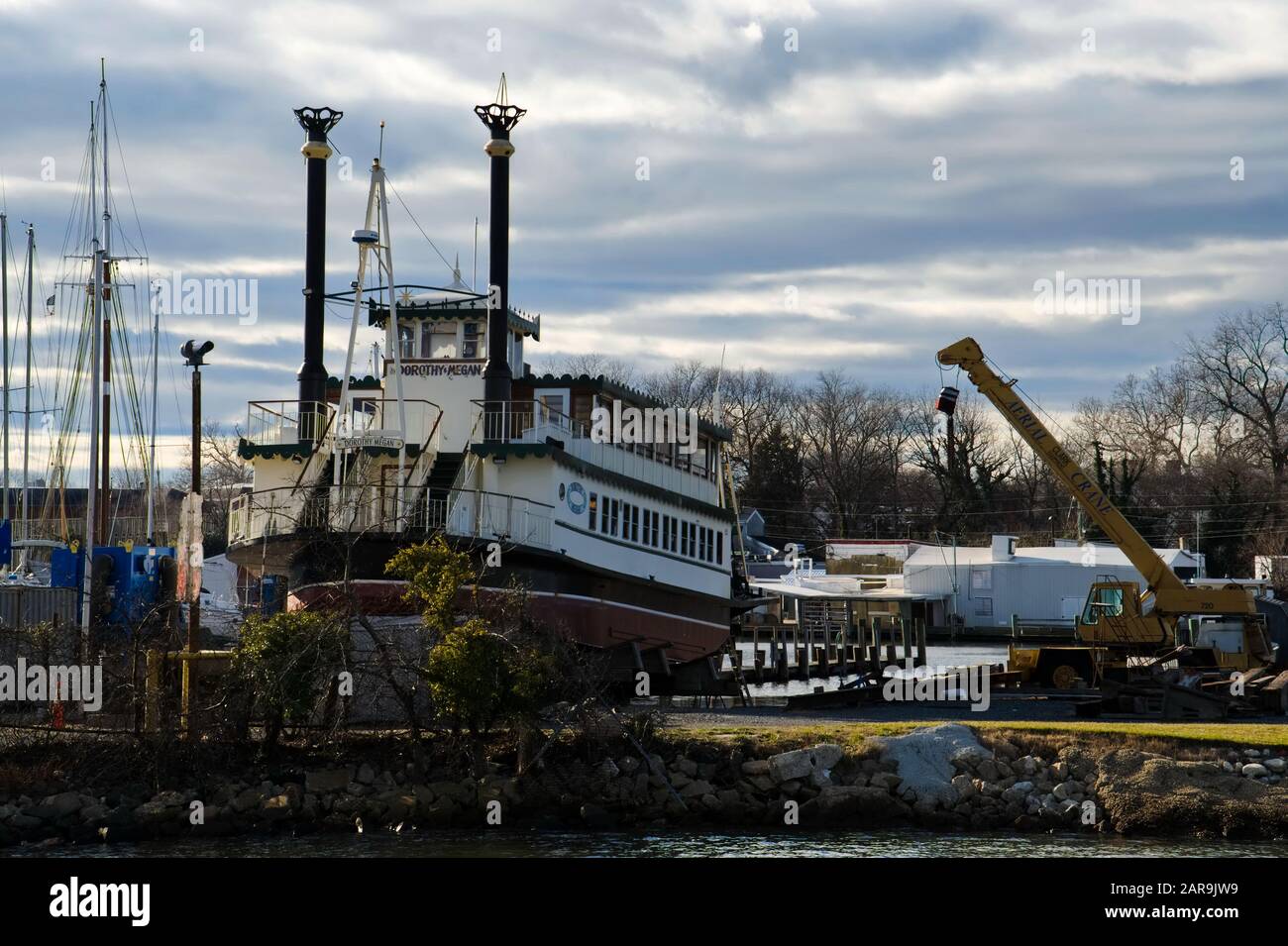 A tourist riverboat and other vessels are seen on cradles at a commercial boatyard during the winter haulout. Stock Photo