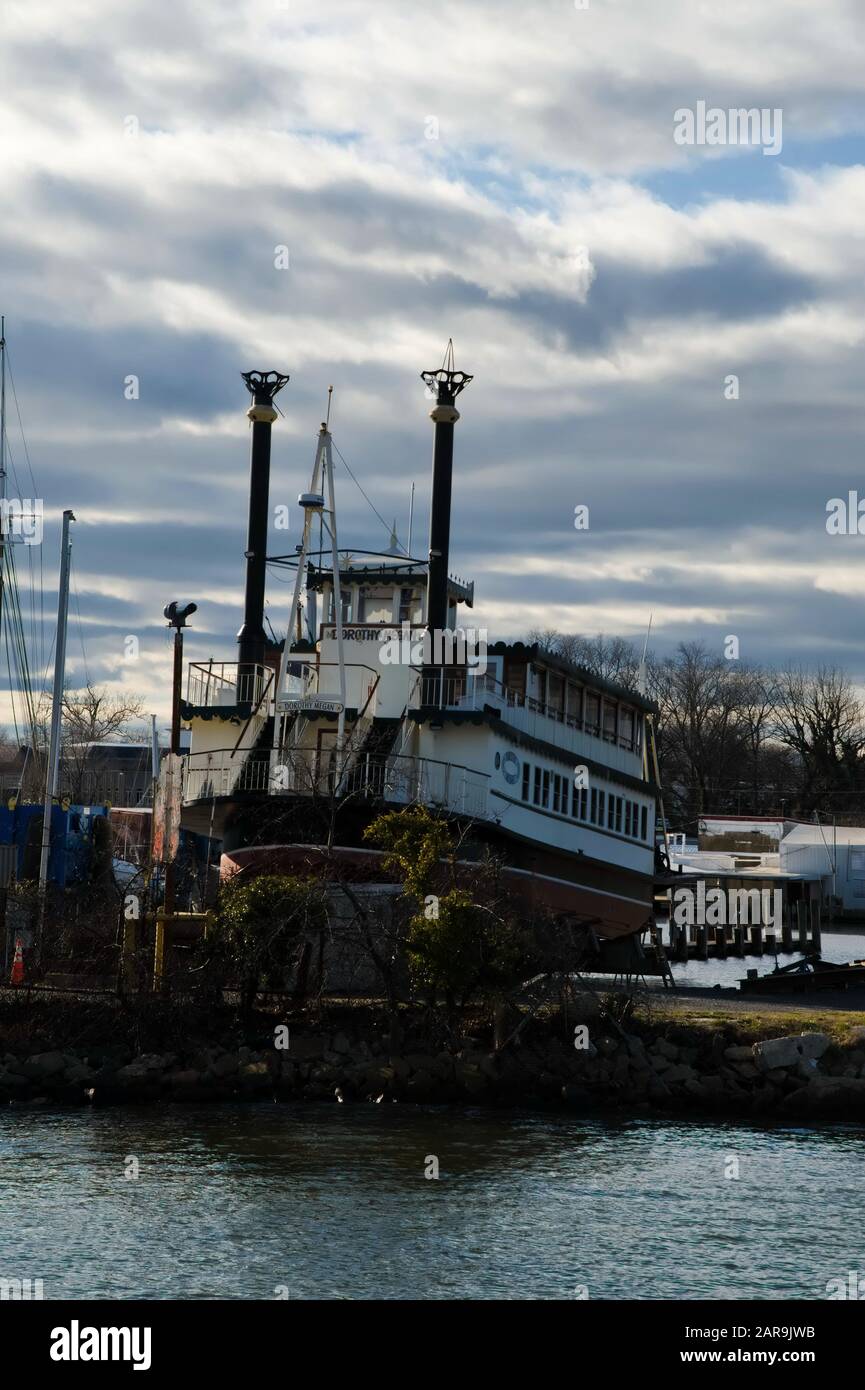 A tourist riverboat and other vessels are seen on cradles at a commercial boatyard during the winter haulout. Stock Photo