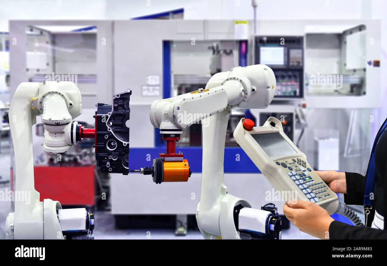 Engineer check and control automation Modern robotic machine vision system in factory, Industry Robot concept . Stock Photo