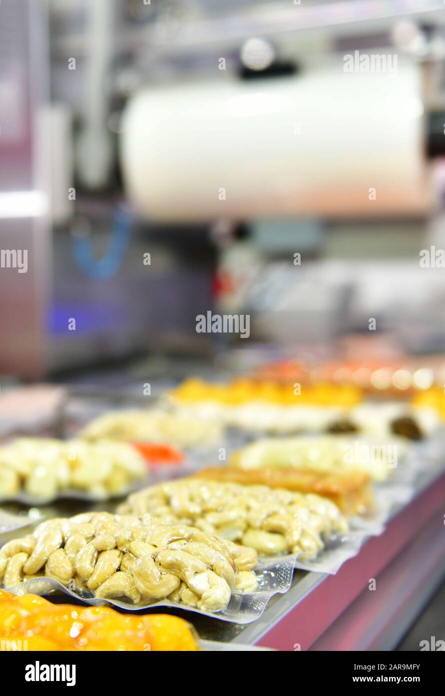 Automatic Bean food production line on conveyor belt equipment machinery in factory, industrial food production. Stock Photo