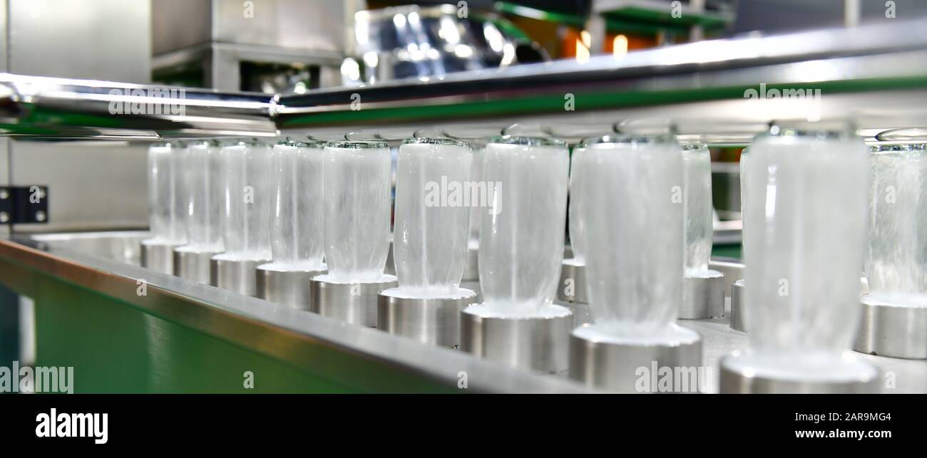 Cleaning glass bottles in industrial plants,banner side Stock Photo