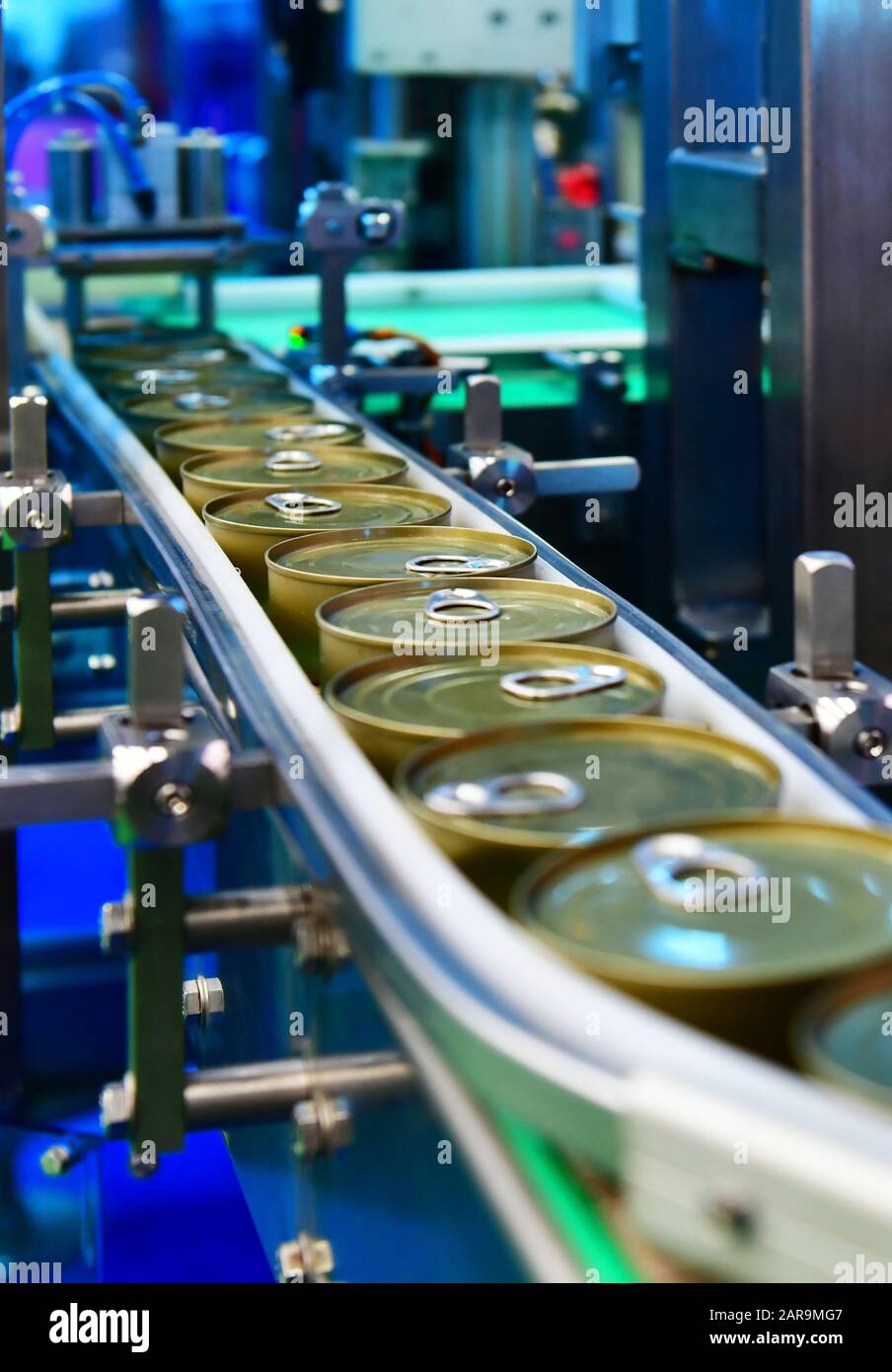Canned food products on conveyor belt in distribution warehouse.parcels