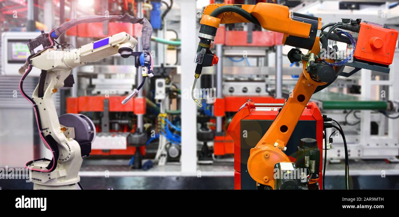 Orange Robotic and white Robotic hand machine tool system in factory, Industry Robot concept Stock Photo