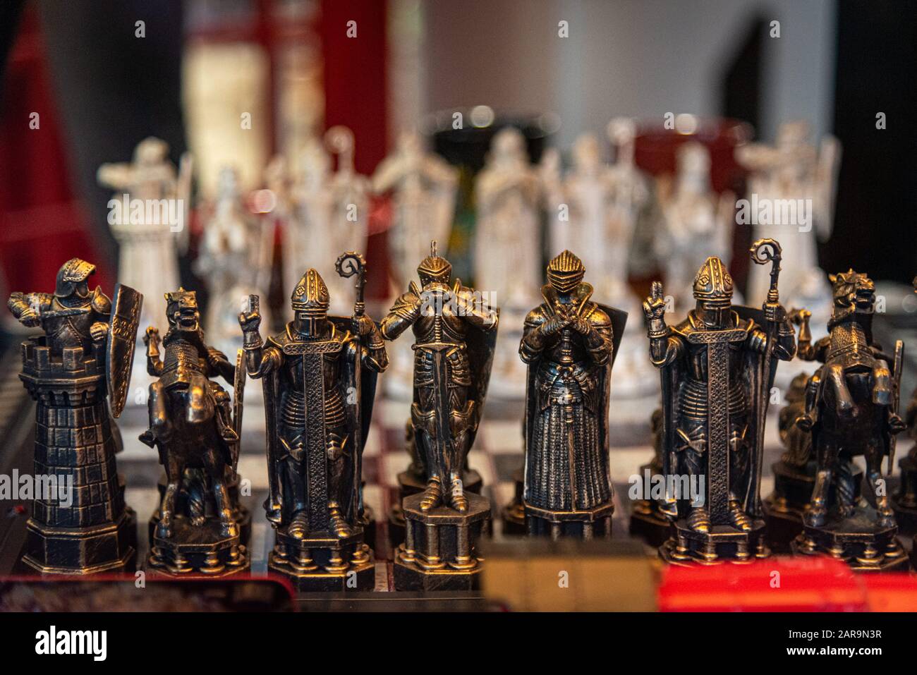 LIVERPOOL, ENGLAND, DECEMBER 27, 2018: The Wizard Chess model. Figurines of the Harry Potter chess game. Focused on blacks while whites are in bokeh. Stock Photo