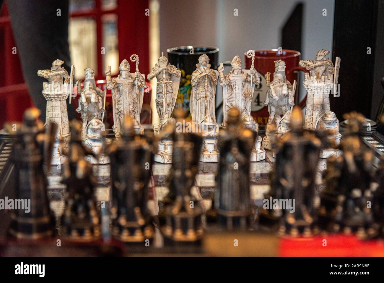 LIVERPOOL, ENGLAND, DECEMBER 27, 2018: The Wizard Chess model. Figurines of the Harry Potter chess game. Focused on whites while blacks are in bokeh. Stock Photo