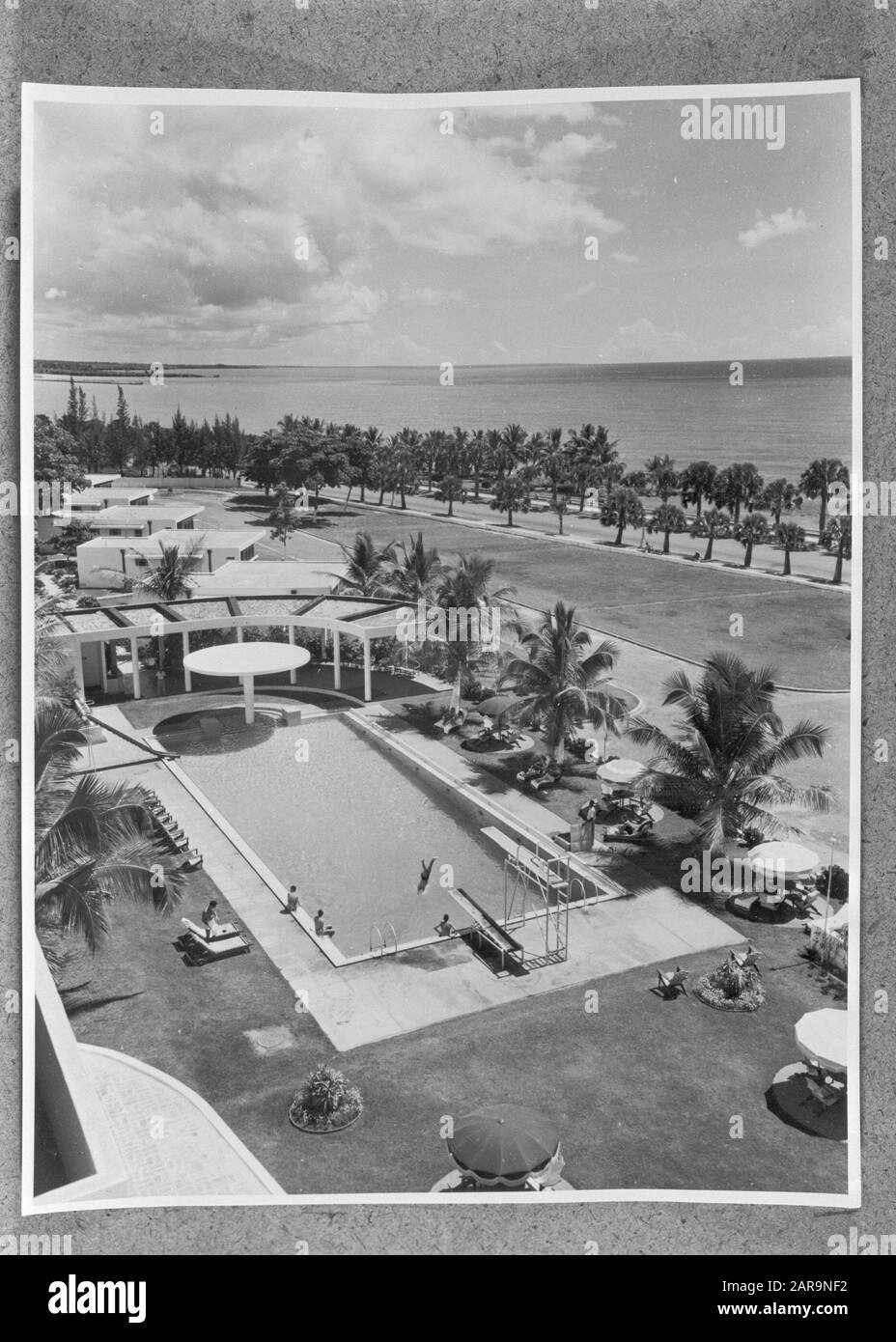 Swimming pool at hotel Jaragua in Ciudad Trujillo in the Dominican Republic Annotation: Ciudad Trustillo is called since 1961 Santo Domingo Date: 1 October 1955 Location: Dominican Republic Keywords: buildings, swimming pools Stock Photo