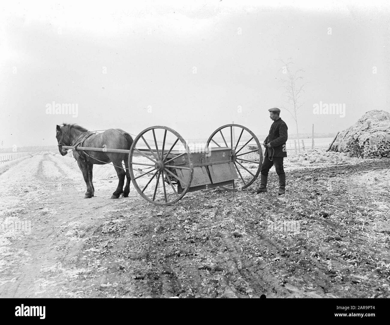 agricultural implements, fertilizer spreader Date undated Keywords agricultural tools Person