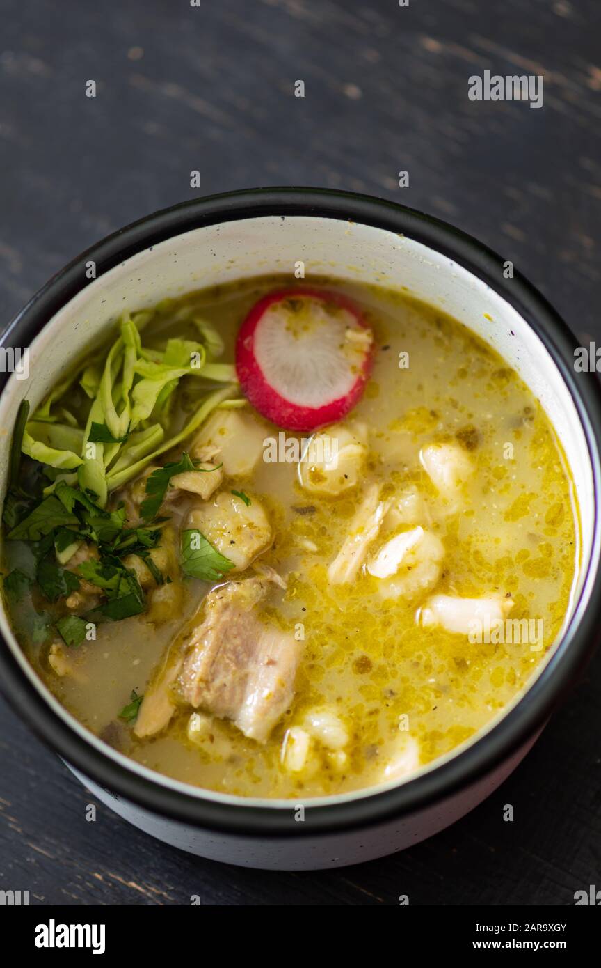 Pozole verde, or green posole is traditionally made with hominy and ...