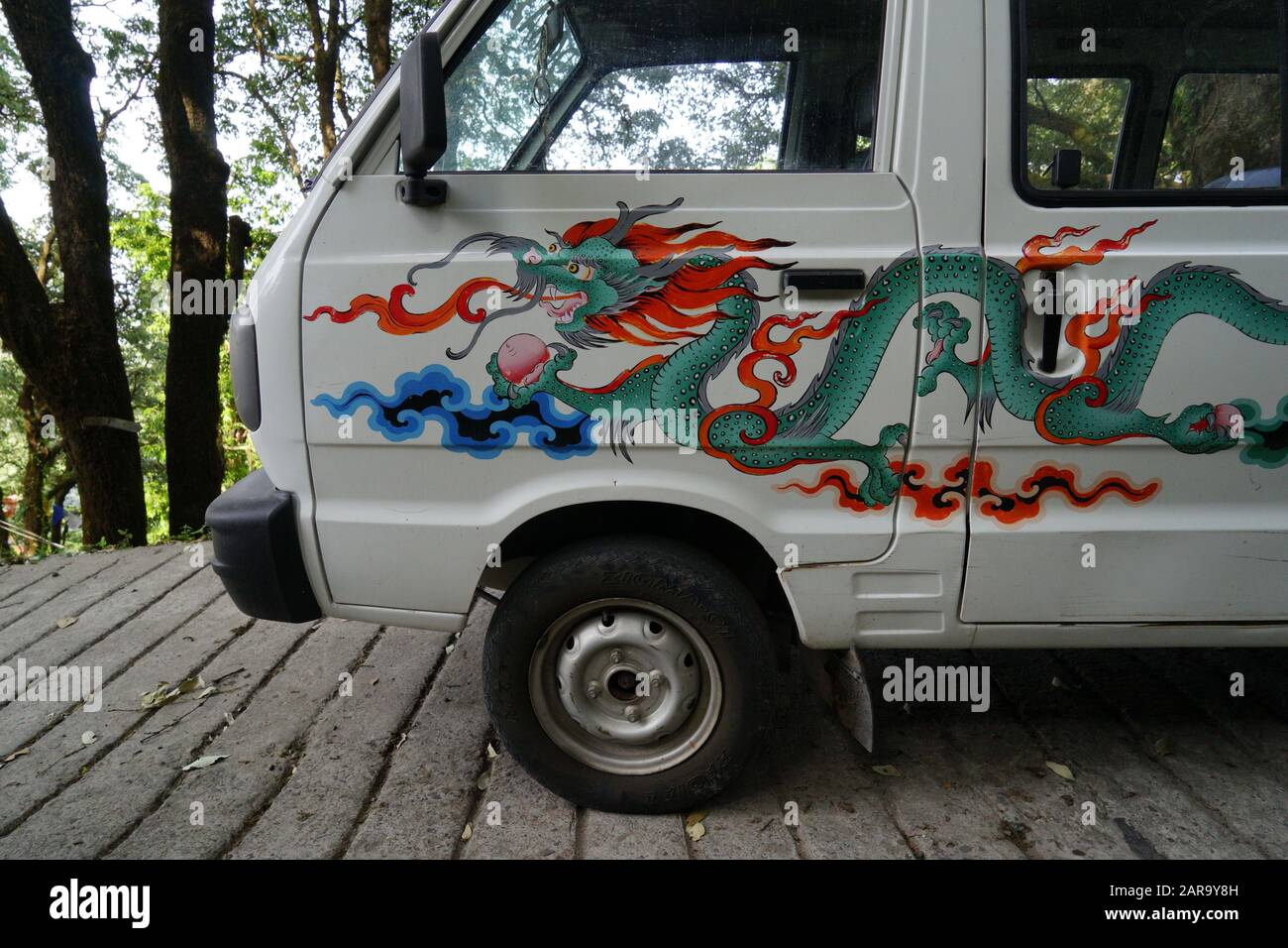 Car painted with Chinese dragon, Landour, Mussoorie, Uttarakhand, India, Asia Stock Photo