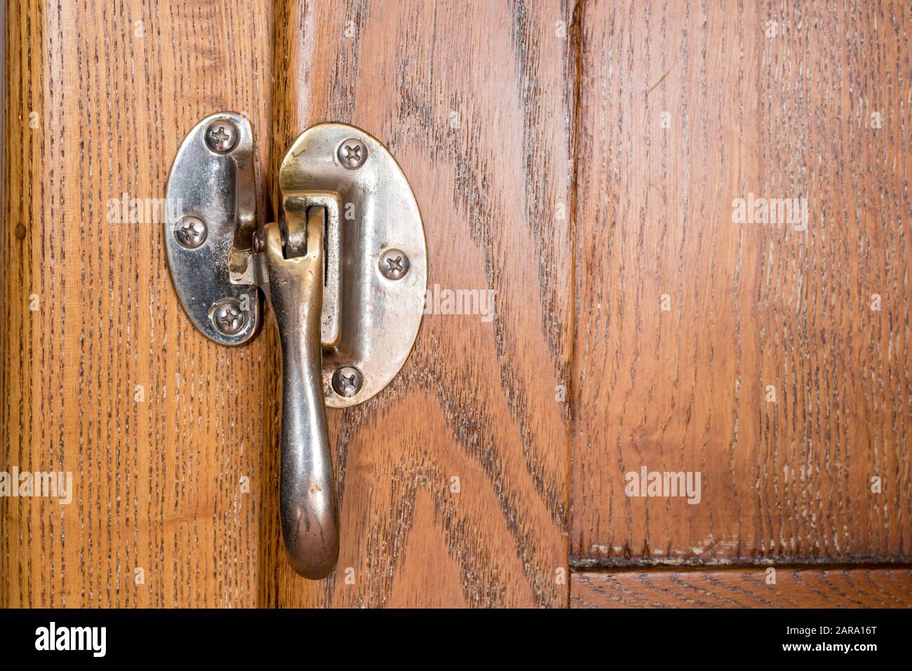 Door latch on an antique Ice King ice box. Stock Photo