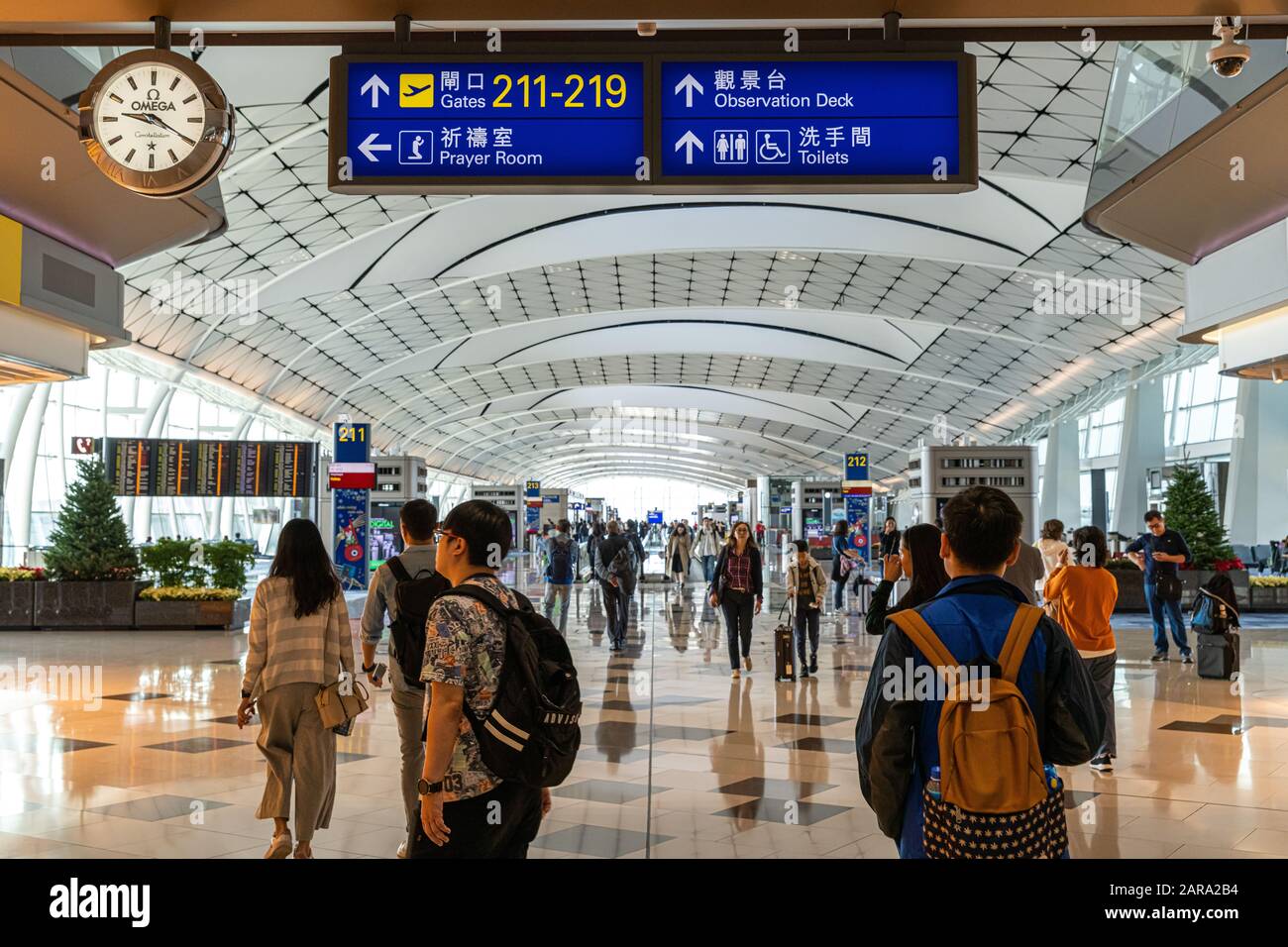 Lantau, Hong Kong  - November 16, 2019 :  Passengers carries luggage at Hong Kong International Airport Stock Photo
