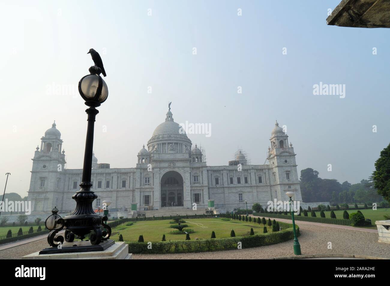 Crow sitting on lamp post, Victoria Memorial, Kolkata, West Bengal, India, Asia Stock Photo