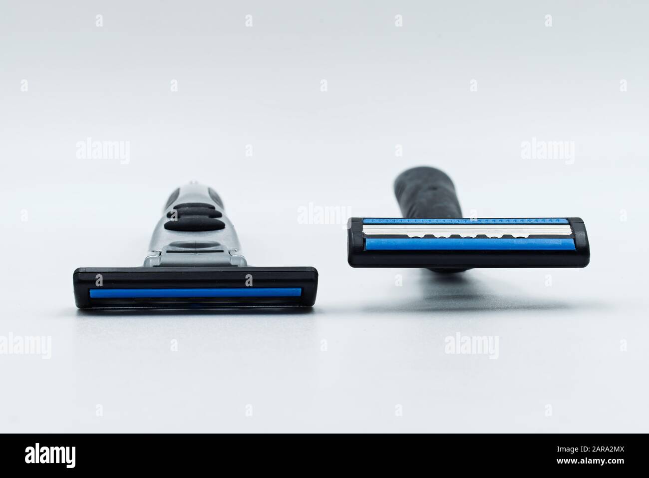 Two razors isolated on a white background. Stock Photo