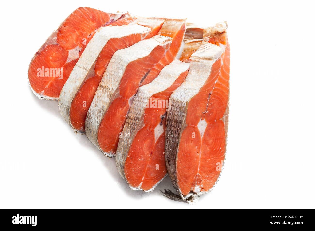 Delicious steaks of coho salmon fish after freezing before cooking in a