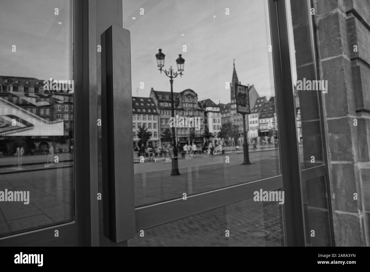 Street reflection on glass door, Old Lamp, Strasbourg, Alsace, France, Europe Stock Photo
