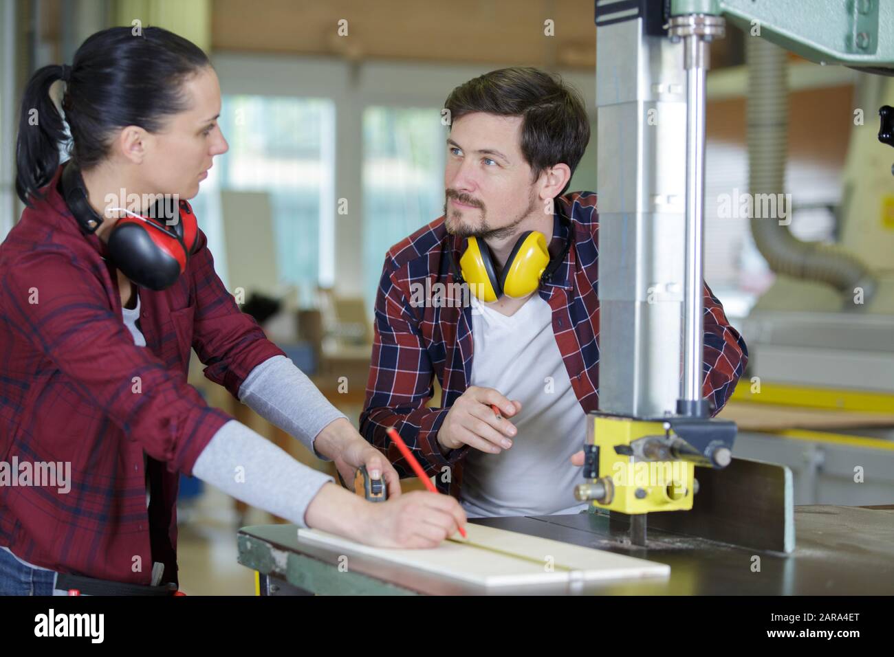 female carpentry apprentice using machinery Stock Photo Alamy