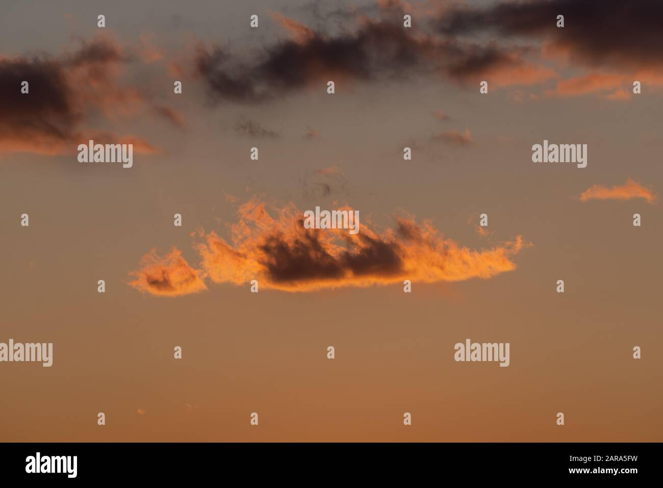 Dramatic sunset sky with orange colored clouds Stock Photo - Alamy