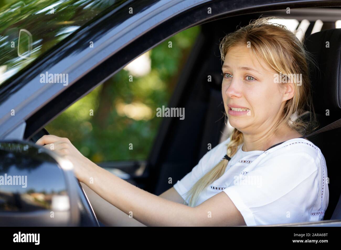 a young woman is terrified Stock Photo