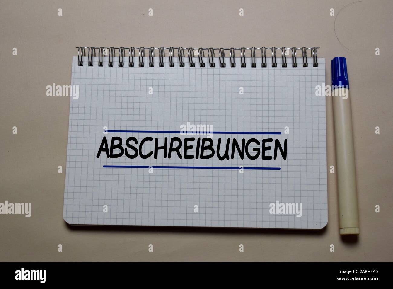 Abschreibungen write on a book isolated on office desk. German Language