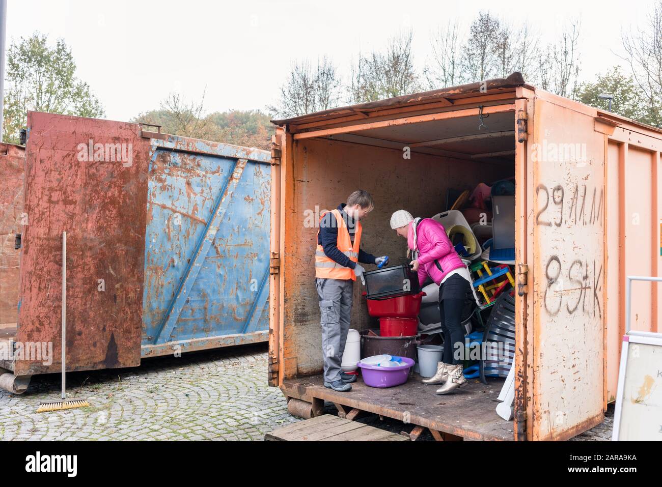 Man and woman in recycling center Stock Photo