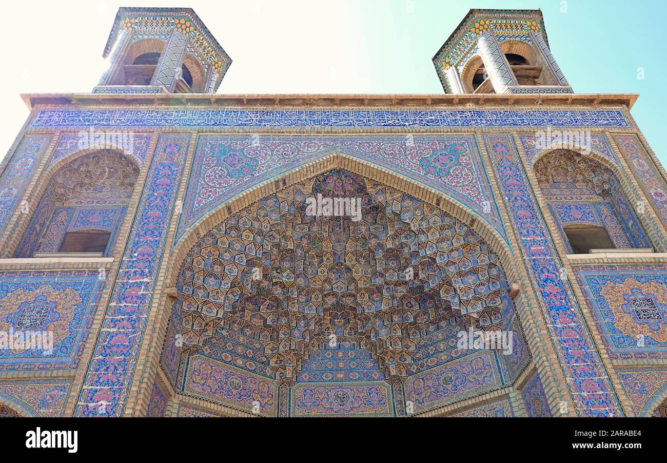 Colorful mosaic patterns and architectural details on the gate of Nasir Al-Mulk Mosque (Pink Mosque) in Shiraz, Stock Photo