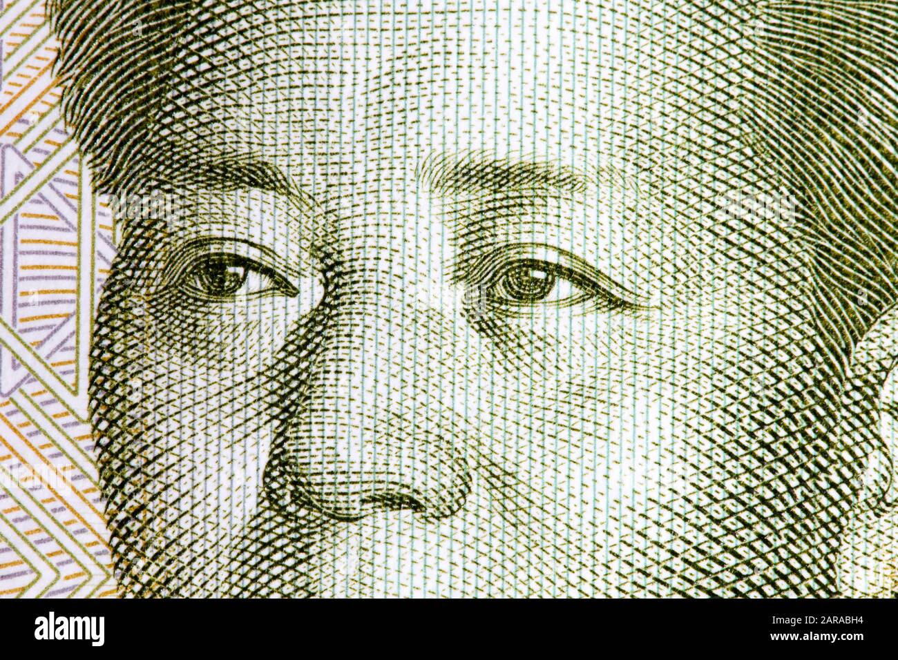 Eyes of the chairman Mao fron one yuan banknote on macro. Stock Photo